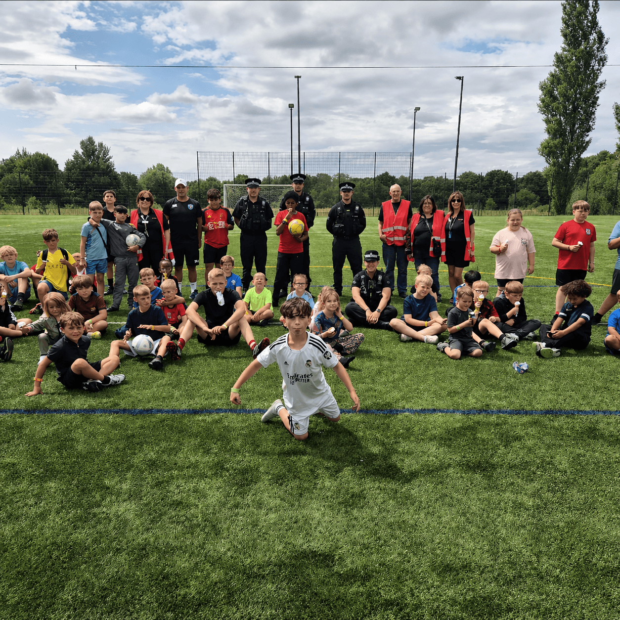 Children, volunteers and police at Brinnington Community Sports Day